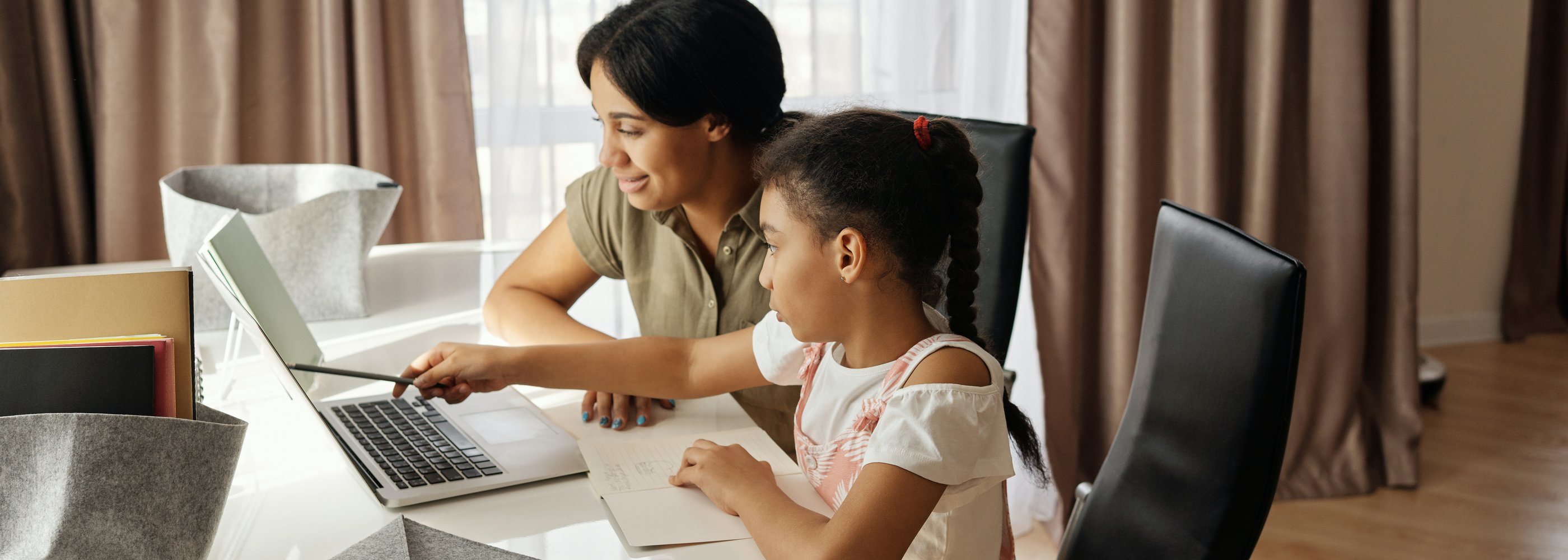 mother with daughter at a computer