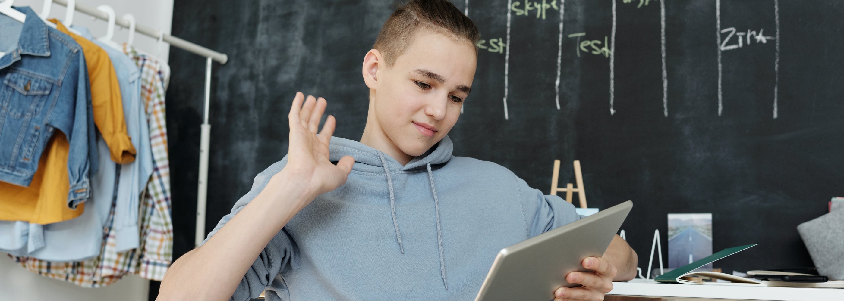 boy raising hand